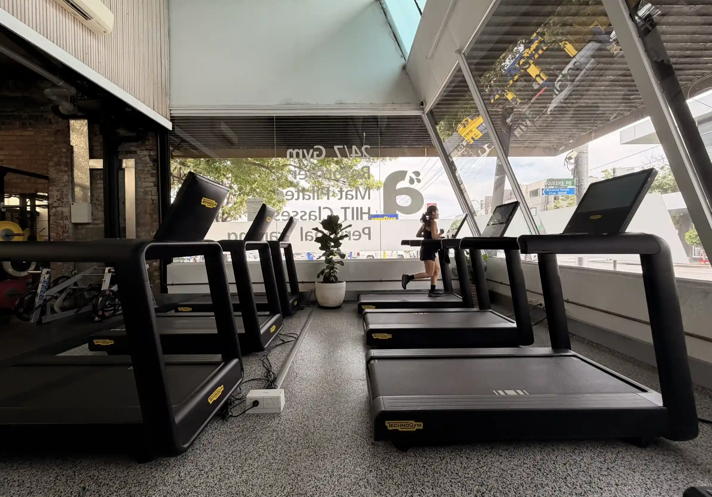 Premium cardio equipment zone at Aptus Health Club Camberwell featuring treadmills, ellipticals and scenic views for motivating workouts